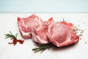 Three raw pork chops