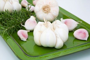 641-01506793 Model Release: No Property Release: No Fresh garlic and rosemary on tray, close-up