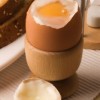 A4GBR4 Soft boiled egg with the top off in a breakfast setting.